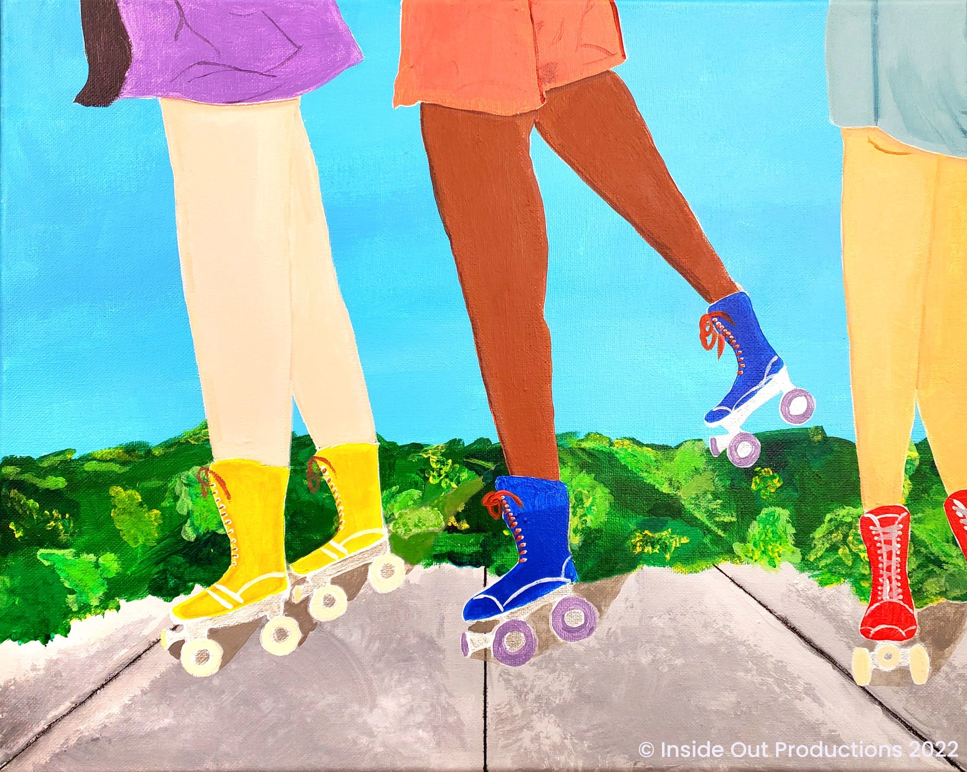 Three girls roller skate on a sidewalk by vegetation. The viewer only sees the girl's legs as they flow by. It is a bright sunny day and the colors are crisp and brilliant.