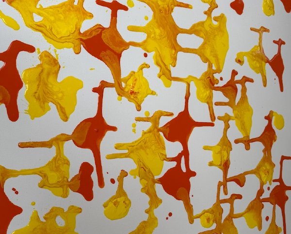 A pattern of alternating red and yellow round paint splotches with intersecting lines.
