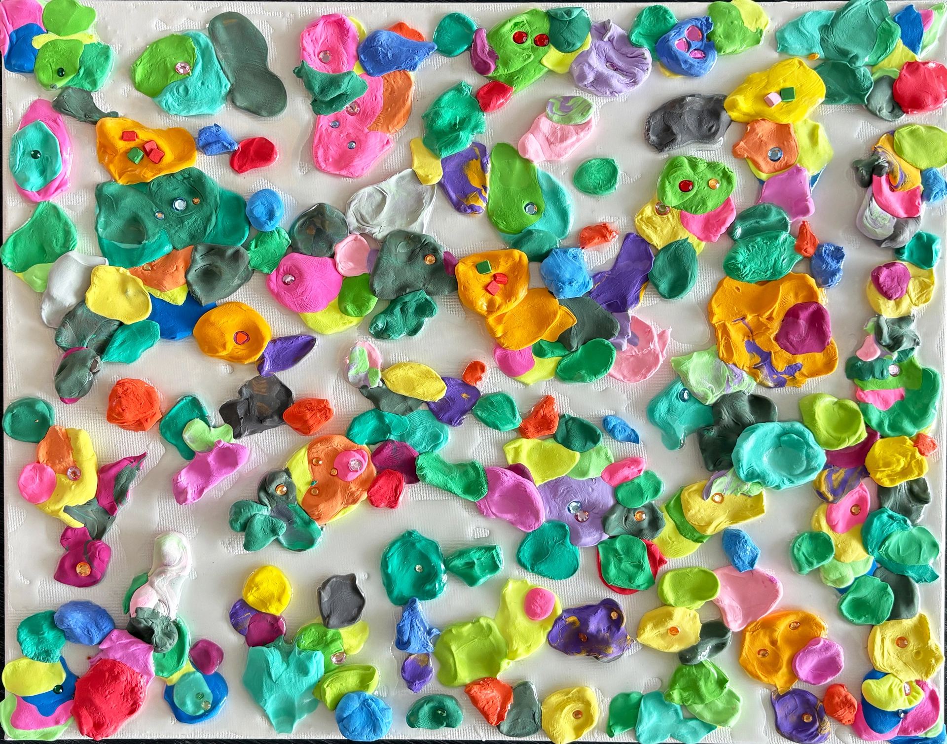 Colorful clumps of three-dimensional clay fill a canvas leaving little empty white space.