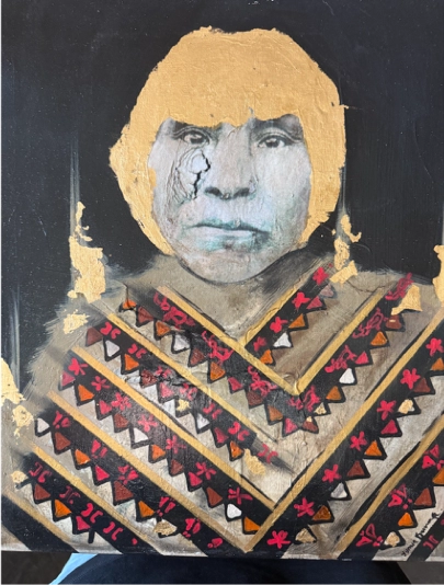 A portrait of an indigenous Latino person with a strong gaze forward. Yellow paint covers their hair and surrounds their face. The shoulders and chest are wrapped in chevron print in multiple rows of yellow borders and red flowers on black background trimmed with orange, brown, white, and red triangles.